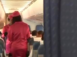 Tremendous air hostess sucking pilots big pecker